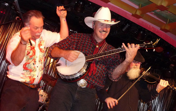 Steve Riddle, left, and Rob Quist of the Mission Mountain Wood Band get down on a Caribbean cruise ship in 2010. 